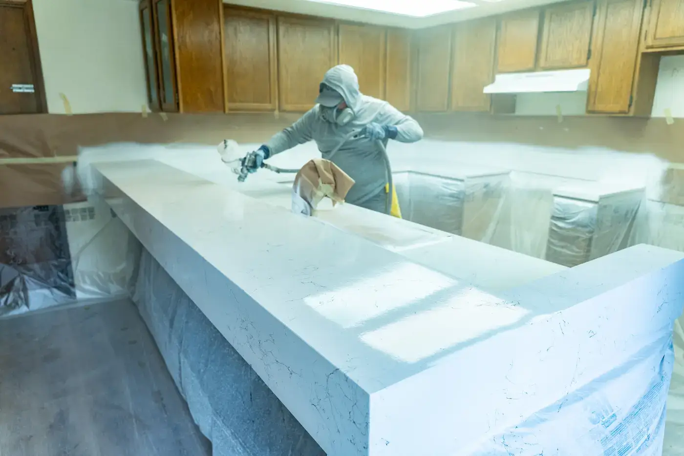 Grit Co spraying a custom stone-look countertop on-site